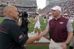 Boston College head coach Steve Addazio, left, and Virginia Tech head coach Justin Fuente, right, shake hands after an NCAA college football game, in Blacksburg Va. Saturday Sept. 17, 2016. Virginia Tech defeated Boston College 49-0. (Matt Gentry/The Roanoke Times via AP)