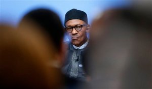 FILE- In this Thursday, May 12, 2016 file photo, Nigeria President Muhammadu Buhari listens during a panel discussion at the Anti-Corruption Summit in London, England. Nigeria's military says some officers are selling arms and ammunition to Boko Haram, indicating the corruption bedeviling the country's fight against the Islamic extremists continues despite government efforts to halt graft. The admission comes three weeks after the Nigerian army said a military tribunal is trying 16 officers and troops accused of offenses related to the fight against Boko Haram, including the theft and sale of ammunition. (AP Photo/Frank Augstein, Pool, File)