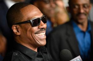 FILE - In this Sept. 6, 2016 file photo, Eddie Murphy, a cast member in "Mr. Church," is interviewed at the premiere of the film at the ArcLight Hollywood  in Los Angeles. It took the dramatic “Mr. Church” to lure Eddie Murphy back to the big screen. The comedian returns with the tear-jerker, but he hopes to have us all laughing soon; the comedian is coming up with ideas for a comedy tour, which he says will be his last.  (Photo by Chris Pizzello/Invision/AP)