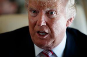 Republican presidential candidate Donald Trump speaks with members of the press, Monday, Sept. 5, 2016, aboard his campaign plane, while flying over Ohio. (AP Photo/Evan Vucci)