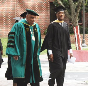Newly invested President and CEO Eddie N. Moore, Jr. of Norfolk State University participates in a ceremonial walk from the Wilder Center to the Communications Tower while speaking with long-time Athletic Director Marty L. Miller (right) on Friday, Sept. 16, 2016. (Photo by Malik Glaspie, Spartan Echo managing editor)