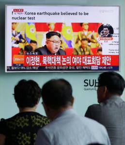 People watch a TV news program showing North Korean leader Kim Jong Un at the Seoul Railway Station in Seoul, South Korea, Friday, Sept. 9, 2016. North Korea said Friday it conducted a "higher level" nuclear warhead test explosion, which it trumpeted as finally allowing it to build "at will" an array of stronger, smaller and lighter nuclear weapons. It is Pyongyang's fifth atomic test and the second in eight months. The letters read " South Korean parties hold emergency meetings on North Korea's nuke test." (AP Photo/Ahn Young-joon)