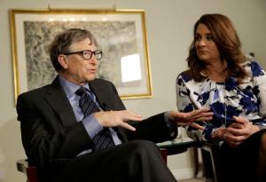 FILE - In this Monday, Feb. 22, 2016 file photo, Bill and Melinda Gates talk to reporters about the 2016 annual letter from their foundation, the Bill and Melinda Gates Foundation, in New York. Researchers are trying to infect mosquitoes in Brazil and Colombia with a type of bacteria that could prevent them from spreading Zika virus and other dangerous diseases. British and American governments are teaming up with the Bill and Melinda Gates Foundation and the U.K.-based Wellcome Trust to expand field tests in Rio de Janeiro in Brazil and the city of Bello in northwest Colombia, philanthropist Bill Gates told a conference Wednesday Oct. 26, 2016. (AP Photo/Seth Wenig, File)