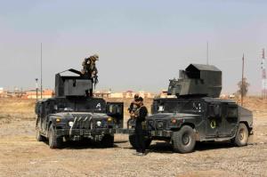 Iraqi forces prepare during an offensive to retake Mosul from Islamic State militants outside Mosul, Iraq, Wednesday, Oct. 19, 2016. A senior Iraqi general on Wednesday called on Iraqis fighting for the Islamic State group in Mosul to surrender as a wide-scale operation to retake the militant-held city entered its third day. (AP Photo/Khalid Mohammed)