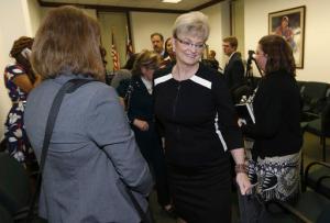 FILE – In this Feb. 11, 2016, file photo, Heidi Thomas, a Denver woman who claims she was assaulted by comedian Bill Cosby, heads to a hearing room after a news conference at the State Capitol in Denver. Prosecutors preparing for comedian Bill Cosby's sexual assault trial hope to call 13 other accusers, but the defense will try again to have the case thrown out at a pretrial hearing starting Tuesday, Nov. 1, 2016, in the Philadelphia suburb of Norristown, Pa. The Associated Press does not typically name people who say they are sexual assault victims, but Heidi Thomas has spoken out publicly. (AP Photo/David Zalubowski, File)