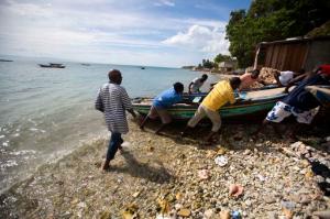 Fishermen move their boats out of the water before the arrival of Hurricane Matthew in Arcahaie, Haiti. Sunday Oct. 2, 2016. A powerful Hurricane Matthew moved slowly Sunday across the Caribbean Sea on a track that authorities warned could trigger devastation in parts of Haiti. ( AP Photo/Dieu Nalio Chery)