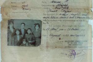 This picture taken Oct. 1, 2016, shows part of the Najjar family's passport, Syrian migrants who came to the United States in 1920 and is displayed at the "Little Syria, N.Y. An Immigrant Community's Life and Legacy" exhibit at the Ellis Island National Museum of Immigration.. Little Syria was a neighborhood that existed between the 1880s and 1940s in Lower Manhattan and was composed of Arab-Americans, both Christians and Muslims, who arrived from what is now Syria and surrounding countries. (AP Photo/Andres Kudacki)