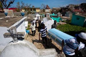 People carry the coffin of Roberto Laguerre to bury him at the cemetery in Jeremie, Haiti, Saturday, Oct. 8, 2016. Roberto, 32, died when the wall of a church next door to his home fell during Hurricane Matthew. (AP Photo/Dieu Nalio Chery)