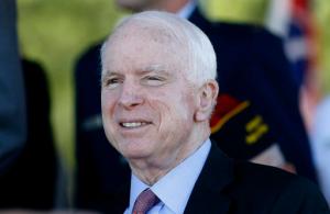 In this May 30, 2016, photo, Sen. John McCain, R-Ariz, watches during a Phoenix Memorial Day Ceremony at the National Memorial Cemetery of Arizona in Phoenix. Republican Senate candidates are jumping on news of sharply rising premiums under President Barack Obama’s health care law as they seek advantage in the closing days of the election. The unpopular law was already an issue in some key Senate races, a recurring attack line for GOP candidates and in some cases another way to tie Democrats to Hillary Clinton. (AP Photo/Ralph Freso, File)