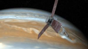 This undated artist's rendering shows NASA's Juno spacecraft making one of its close passes over Jupiter. NASA said Wednesday, Oct. 19, 2016, that the Juno spacecraft circling Jupiter went into safe mode, turning off its camera and instruments. The space agency said the Juno craft is healthy as engineers try to figure out what went wrong. (NASA via AP)