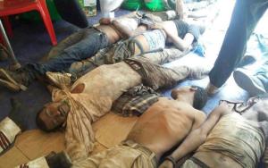 In this photo made available by OMN, the bodies of people crushed during a religious festival are gathered, in Bishoftu, Ethiopia, Sunday, Oct. 2, 2016. Dozens of people were crushed to death Sunday in a stampede after police fired tear gas and rubber bullets to disperse an anti-government protest that grew out of a massive religious festival, witnesses said. (OMN via AP)