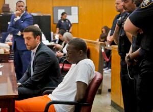 Rapper Bobby Shmurda, whose birth name is Ackquille Pollard, right, appears with his lawyer Alex Spiro in a Manhattan court on Wednesday Oct. 19, 2016, in New York. Shmurda, best known for "Hot Boy," a gritty hit song with rhymes about street violence, was sentenced to seven years in prison on charges he conspired with a drug gang in several shootings. (AP Photo/Bebeto Matthews)