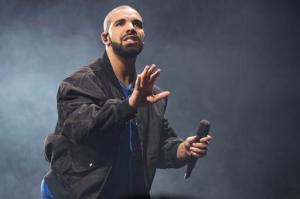 FILE - In this Oct. 8, 2016 file photo, Drake performs on stage in Toronto, Canada. Drake is the leading nominee with 12 nominations at the Soul Train Awards. The show will air on BET and Centric on Nov. 27.(Photo by Arthur Mola/Invision/AP, File)