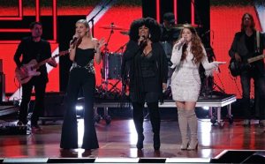 Kelsea Ballerini, from left, Jill Scott and Meghan Trainor perform a tribute to Shania Twain during the CMT Artists of the Year awards show at the Schermerhorn Symphony Center on Wednesday, Oct. 19, 2016, in Nashville, Tenn. (Photo by Wade Payne/Invision/AP)