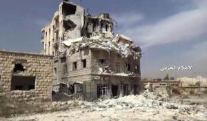 In this still image taken from video provided by the Syrian government-controlled Syrian Central Military Media, damaged buildings inside the Bustan Al-Basha neighborhood of Aleppo, Syria on Tuesday, Oct. 4, 2016.  The footage shows extensive destruction to buildings in the neighborhood and a factory of hand-made bombs using home gas bottles as shells. (Syrian Central Military Media via AP)