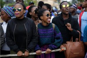 Students from the University of the Witwatersrand march Wednesday, Oct. 19, 2016 through downtown Johannesburg, South Africa. Protests calling for free education have sometimes turned violent, not this time, and have roiled many South African universities since last month. (AP Photo/Jerome Delay)