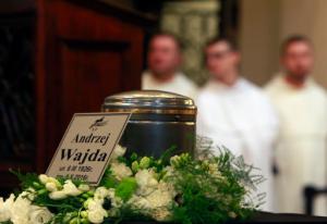 People pay their respects to Poland filmmaker Andrzej Wajda, in Krakow, Poland, Wednesday, Oct. 19, 2016. Wajda died in hospital on Oct. 9, at the age of 90. He will be laid to rest at Krakow's Salwator Cemetery where his mother is buried. (AP Photo/Czarek Sokolowski)