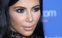 FILE - In this June 24, 2015, file photo, Kim Kardashian poses during a photo call at the Cannes Lions 2015. A spokeswoman for Kardashian West says she was held up at gunpoint inside her Paris hotel room Sunday, Oct. 2, 2016,  by two armed masked men dressed as police officers. The representative said the reality TV star is "badly shaken but physically unharmed." She offered no other details. (AP Photo/Lionel Cironneau, File)
