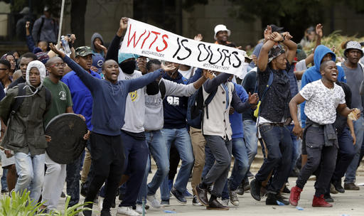South African police fight students demanding free education 