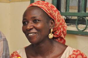 Hawa Abana, mother of Blessing Abana, one among of the freed twenty-one Chibok schoolgirls smiles during an interview in Nasarawa, Nigeria, Saturday, Oct. 15, 2016. Conflicting reports emerged Friday about whether the first negotiated release of some Chibok schoolgirls kidnapped by Boko Haram in Nigeria in 2014 involved a ransom payment, a prisoner swap for Islamic extremist commanders, or both. ( AP Photo/Gbemiga Olamikan)