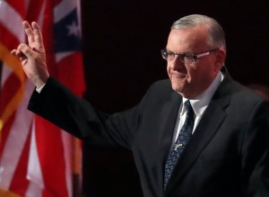 FILE - In this July 21, 2016, file photo, Sheriff Joe Arpaio of Arizona walks on the stage to speak during the final day of the Republican National Convention in Cleveland. A judge will hold a hearing in Phoenix, Ariz., Tuesday, Oct. 11, 2016, to discuss legal issues raised by a recommendation that prosecutors file a criminal contempt-of-court case against Arpaio. The hearing falls the day before early voting starts in Arpaio's bid for a seventh term as metro Phoenix's top law enforcer. (AP Photo/Paul Sancya, File)