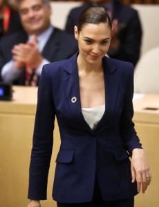 Gal Gadot, star of the upcoming film, "Wonder Woman," takes the podium to address a U.N. meeting to designate Wonder Woman as an Honorary Ambassador for the Empowerment of Women and Girls, Friday, Oct. 21, 2016 at U.N. headquarters. (AP Photo/Bebeto Matthews)