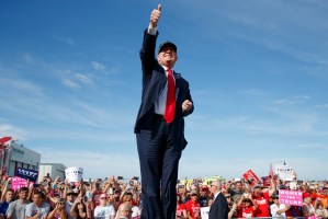 Republican presidential candidate Donald Trump gestures as he arrives to speak to a campaign rally, Tuesday, Oct. 25, 2016, in Sanford, Fla. (AP Photo/ Evan Vucci)