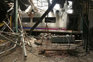 FILE - This Oct. 1, 2016, file photo, provided by the National Transportation Safety Board shows damage done to the Hoboken Terminal in Hoboken, N.J., after a commuter train crash. New Jersey Transit is implementing a new rule after the crash. NJ Transit spokeswoman Jennifer Nelson said the conductor must join the engineer whenever a train pulls into Hoboken Terminal or Atlantic City. That means a second set of eyes will be watching as a train enters the final phase of its trip at stations where there are platforms at the end of the rails. (Chris O'Neil/NTSB photo via AP, File)