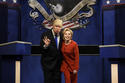 FILE - In a Saturday, Oct. 1, 2016 file photo provided by NBC, Alec Baldwin, left, as Republican presidential candidate, Donald Trump, and Kate McKinnon, as Democratic presidential candidate, Hillary Clinton, perform on the 42nd season of "Saturday Night Live," in New York. Republican presidential candidate Donald Trump tweeted early Sunday morning, Oct. 16, 2016, that the show’s skit depicting him this week was a “hit job.” Trump went on to write that it’s “time to retire” the show, calling it “boring and unfunny” and adding that Alec Baldwin’s portrayal of him “stinks.” (Will Heath/NBC via AP, File)