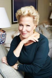 FILE - In this Oct. 7, 2014 file photo, Bette Midler poses for a portrait in New York. The Grammy- and Emmy Award-winner is re-releasing a deluxe version of “The Divine Miss M,” her 1972 debut album that included the hits "Do You Want To Dance," "Chapel Of Love," "Friends" and "Boogie Woogie Bugle Boy." (Photo by Dan Hallman/Invision/AP, File)