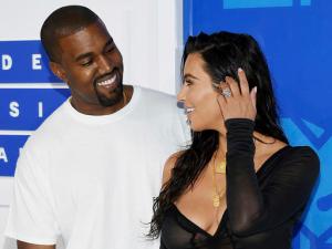 FILE - In this Aug. 28, 2016 file photo, Kanye West, left, and Kim Kardashian West arrive at the MTV Video Music Awards in New York. Armed robbers forced their way into a private Paris residence early Monday, Oct. 3, where Kim Kardashian West was staying and tied her up, police officials said. They said five assailants, who are still at large, stole a jewelry box containing valuables worth 6 million euros ($6.7 million) as well as a ring worth 4 million euros ($4.5 million.) (Photo by Evan Agostini/Invision/AP, File)