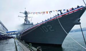 FILE - In this Nov. 3, 2007 file photo, navy personnel line the deck of the Arleigh Burke-class guided-missile destroyer USS Sampson during a commissioning ceremony in Boston. The U.S. Navy warship will visit New Zealand next month for the first time since the 1980s, ending a 30-year-old military stalemate between the countries that was triggered when New Zealand banned nuclear warships. New Zealand Prime Minister John Key announced Tuesday, Oct. 18, 2016, that he had given clearance for the destroyer USS Sampson to visit during celebrations marking the Royal New Zealand Navy's 75th anniversary. (AP Photo/Lisa Poole, File)
