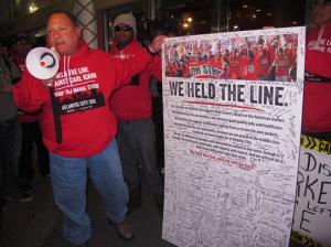 Marc Scittina, a players' club worker at the Trump Taj Mahal casino in Atlantic City, N.J., since shortly after it opened in 1990, addresses strikers who signed a poster critical of billionaire Carl Icahn, who closed the casino on Monday, Oct. 10, 2016. The casino was opened by Republican presidential nominee Donald Trump. (AP Photo/Wayne Parry)
