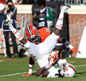 Miami wide receiver Malcolm Lewis (9) catches a pass in front of Virginia strong safety Kelvin Rainey (38) during the first half of an NCAA college football game in Charlottesville, Va. on Saturday, Nov. 12, 2016. (Ryan M. Kelly/The Daily Progress via AP)