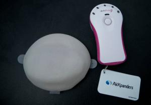 This Thursday, Oct. 20, 2016 photo shows the AeroForm tissue expander, left, and handheld dosage controller at the NewYork-Presbyterian/Columbia University Medical Center. Doctors are testing the device that would let women contribute to the breast reconstruction process at home. It is aimed at not only making treatment more comfortable and convenient, but also giving women a sense of control _ something cancer often takes away. (AP Photo/Mary Altaffer)