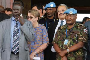 In this photo taken Friday, Sept. 2, 2016, United Nations Mission in South Sudan (UNMISS) force commander Lt. Gen. Johnson Mogoa Kimani Ondieki of Kenya, right, stands next to Ellen Loj, center, Special Representative of the UN Secretary-General, and an unidentified member of South Sudan's government, left, as they await a delegation of U.N. Security Council members, in Juba, South Sudan. Kenya's foreign affairs ministry said Wednesday, Nov. 2, 2016 that it is pulling out its 1,000 troops deployed to South Sudan as part of the U.N. peacekeeping mission after the U.N. secretary-general fired the force's Kenyan commander. (AP Photo/Justin Lynch)