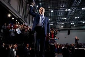 FILE - In this Tuesday, Nov. 8, 2016, file photo, Republican presidential candidate Donald Trump pumps his fist as he arrives to speak at a campaign rally in Grand Rapids, Mich. President-elect Donald Trump inherits a much sturdier economy than the one Barack Obama took into his second term four years ago. Yet economic growth remains stubbornly sluggish and is expected to remain so. (AP Photo/Evan Vucci, File)