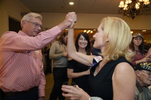 Williamson County Republican Party chairman Julie Hannah,right, high fives a Trump supporter during a Williamson County Republican watch party on election night at Old Natchez Country Club in Franklin, Tenn. on Tuesday, Nov. 8, 2016. (Shelley Mays/The Tennessean via AP)