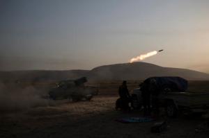 Kurdish Peshmerga soldiers fire artillery at Islamic State positions in Bashiqa, east of Mosul, Iraq, Monday, Nov. 7, 2016. Iraqi Kurdish fighters are exchanging heavy fighters with militants as they advance from two directions on a town held by the Islamic State group east of the city of Mosul. (AP Photo/Felipe Dana)