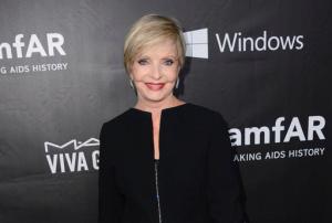 FILE - In this Oct. 29, 2014 file photo, Florence Henderson arrives at the 2014 amfAR Inspiration Gala at Milk Studios in Los Angeles. Henderson, the wholesome actress who went from Broadway star to television icon when she became Carol Brady, the ever-cheerful mom residing over "The Brady Bunch," has died at age 82. She died surrounded by family and friends, her manager, Kayla Pressman, said in a statement late Thursday, Nov. 24, 2016. (Photo by Jordan Strauss/Invision/AP, File)