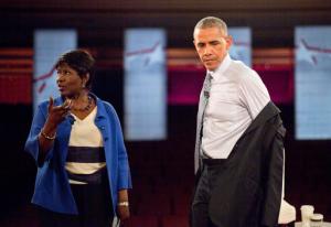 FILE - In this June 1, 2016, file photo, President Barack Obama removes his suit coat as he participates in a televised town hall event at Lerner Theatre in Elkhart, Ind., with PBS NewsHour co-anchor and manager editor Gwen Ifill, left. Ifill died on Monday, Nov. 14, 2016, of cancer, PBS said. She was 61.  (AP Photo/Pablo Martinez Monsivais, File)