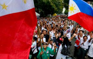 Supporters of the late Philippine dictator Ferdinand Marcos cheer after the Philippine Supreme Court voted 9-5 with one abstention to rule that Marcos can be buried at the heroes' cemetery in a ruling opponents say rolled back the country's democratic triumph when Filipinos ousted the strongman in a 1986 "people power" revolt Tuesday, Nov.8, 2016 in Manila, Philippines. Court spokesman Theodore Te says the 15-member court voted 9-5 with one abstention Tuesday to dismiss petitions opposing President Rodrigo Duterte's approval of Marcos's burial at the cemetery. (AP Photo/Bullit Marquez)