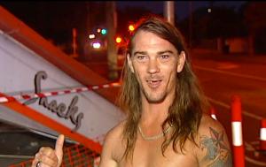 In this photo taken taken from video, local resident Daniel McConnell describes the scene of a car crash during a television interview Thursday, Nov. 24, 2016, in Brisbane, Australia. McConnell, dressed only in his underpants, helped police arrest the unlicensed driver who alleged crashed a car into an Australian takeout restaurant then fled. (Australian Broadcasting Corporation via the AP)