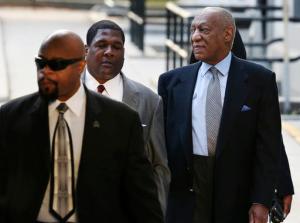 Bill Cosby, right, arrives for a hearing in his sexual assault case at the Montgomery County Courthouse on Tuesday, Nov. 1, 2016, in Norristown, Pa. Prosecutors at the pretrial hearing on Tuesday will ask the judge to let the other accusers testify to show Cosby drugged and molested young women in a "signature" fashion. (AP Photo/Mel Evans)