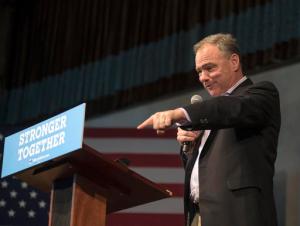 Democratic vice presidential candidate Sen. Tim Kaine, D-Va. points at a supporter while speaking on stage during a rally inside the Brooklyn Arts Center in Wilmington, N.C., Monday, Nov. 7, 2016. (AP Photo/Mike Spencer)