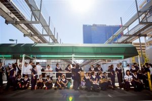 Paris hotel-casino employees wait outside of the establishment for updates of the power outage on Thursday, Nov. 3, 2016, in Las Vegas. (Elizabeth Page Brumley/Las Vegas Review-Journal via AP)