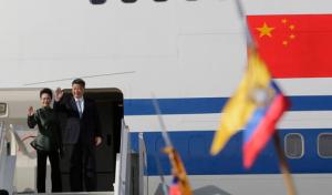 China's President Xi Jinping and his wife Peng Liyuan wave goodbye from their plane as they depart Quito, Ecuador, Friday, Nov. 18, 2016. Xi Jinping was in Ecuador for two days before heading to Peru for the APEC summit. (AP Photo/Dolores Ochoa)
