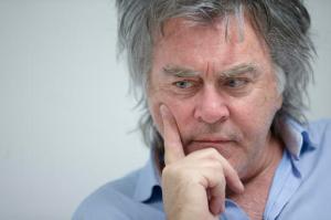 FILE – In this Feb. 19, 2016, file photo, Hillsboro, Ohio, Mayor Drew Hastings, who is a veteran standup comedian, pauses during an interview at his office in Hillsboro, Ohio. A final pretrial hearing is planned Wednesday, Oct. 12, 2016, for Hastings, whose trial on four felony counts alleging misconduct in office is scheduled to begin Nov. 7. (AP Photo/John Minchillo, File)