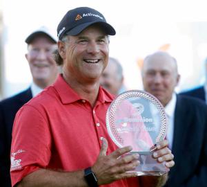 Scott McCarron holds the trophy after winning the Dominion Charity Classic golf tournament Sunday, Nov. 6, 2016, in Richmond, Va. (Alexa Welch Edlund/Richmond Times-Dispatch via AP)