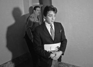 FILE - In this Jan. 21, 1970 file photo, Robert K.Beausoleil, then 21, leaves a courtroom in Los Angeles. California officials have denied parole for the follower of cult leader Charles Manson who is serving a life prison term for a murder he committed 47 years ago. Parole officials announced Friday, Oct. 14, 2016, that Beausoleil will remain in prison for the 1969 death of musician Gary Hinman. (AP Photo/George Brich, File)